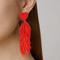 orecchini pendenti perline rosse